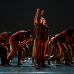 Trinity Laban Youth Dance Company group pose against a dark back drop